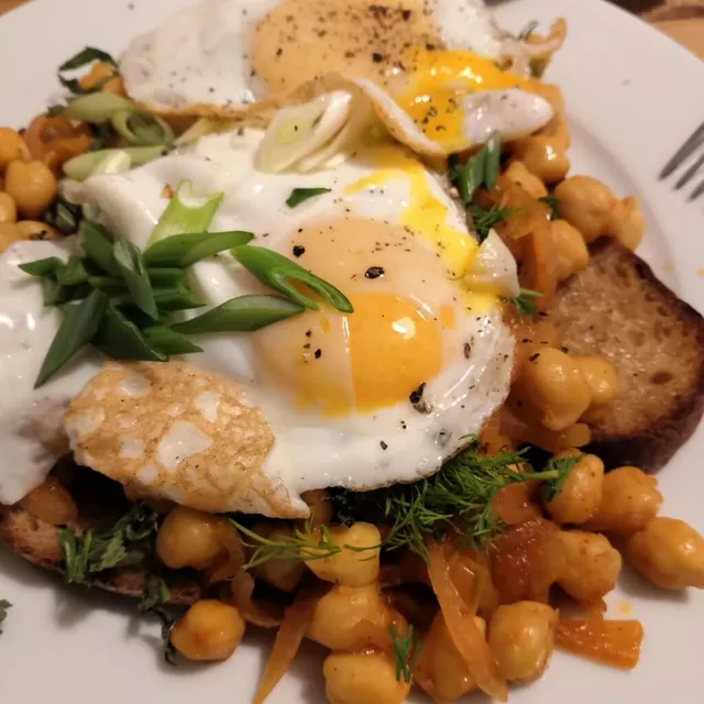Photo of Harissa chickpeas with fried eggs