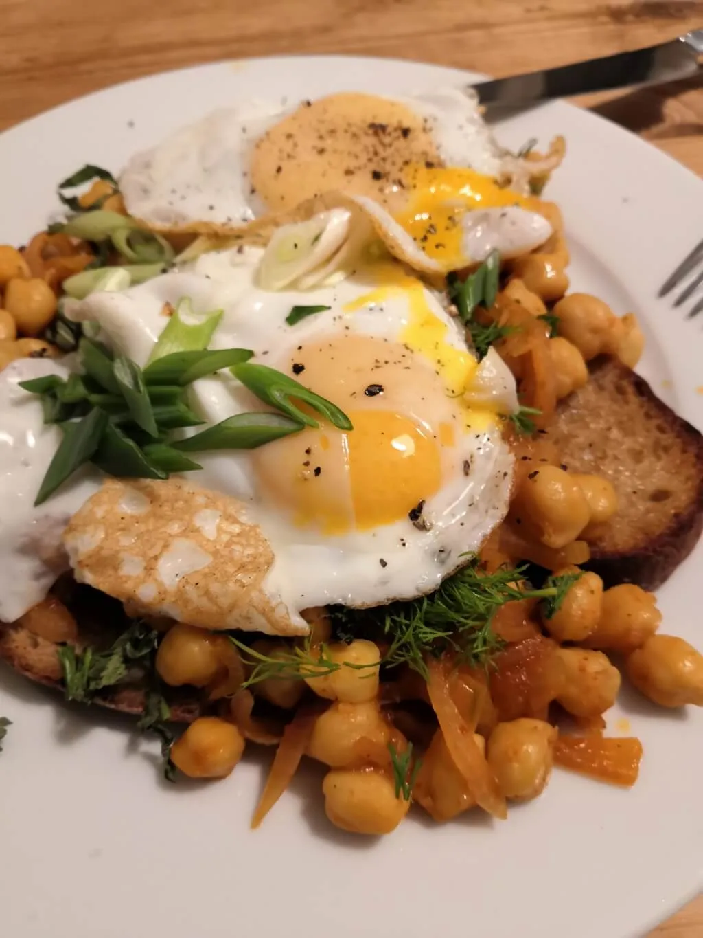 Photo of Harissa chickpeas with fried eggs