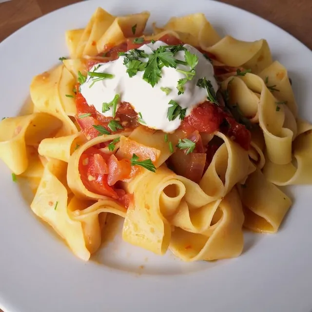 Photo of Papardelle with harissa, olives and capers